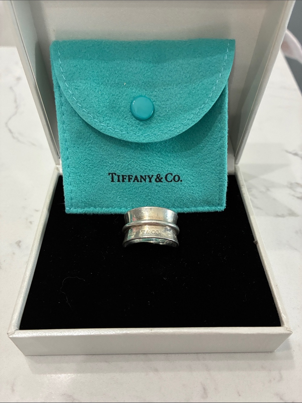 Tiffany & Co. Sterling Silver Ring with Signature Turquoise Pouch. Size 13.